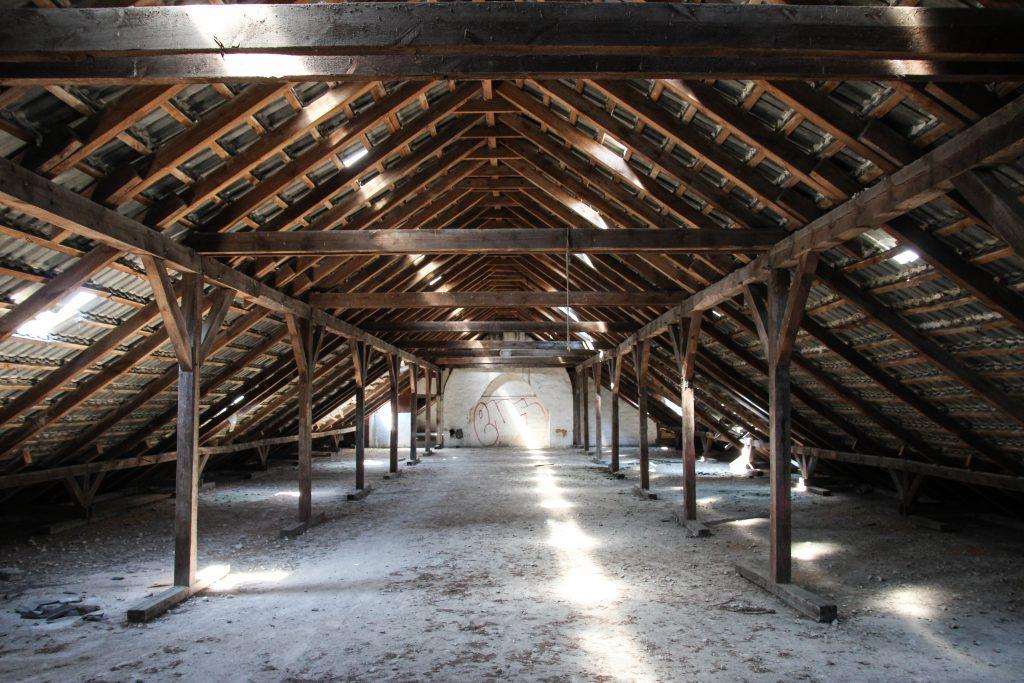 Empty wooden shed with light shining in